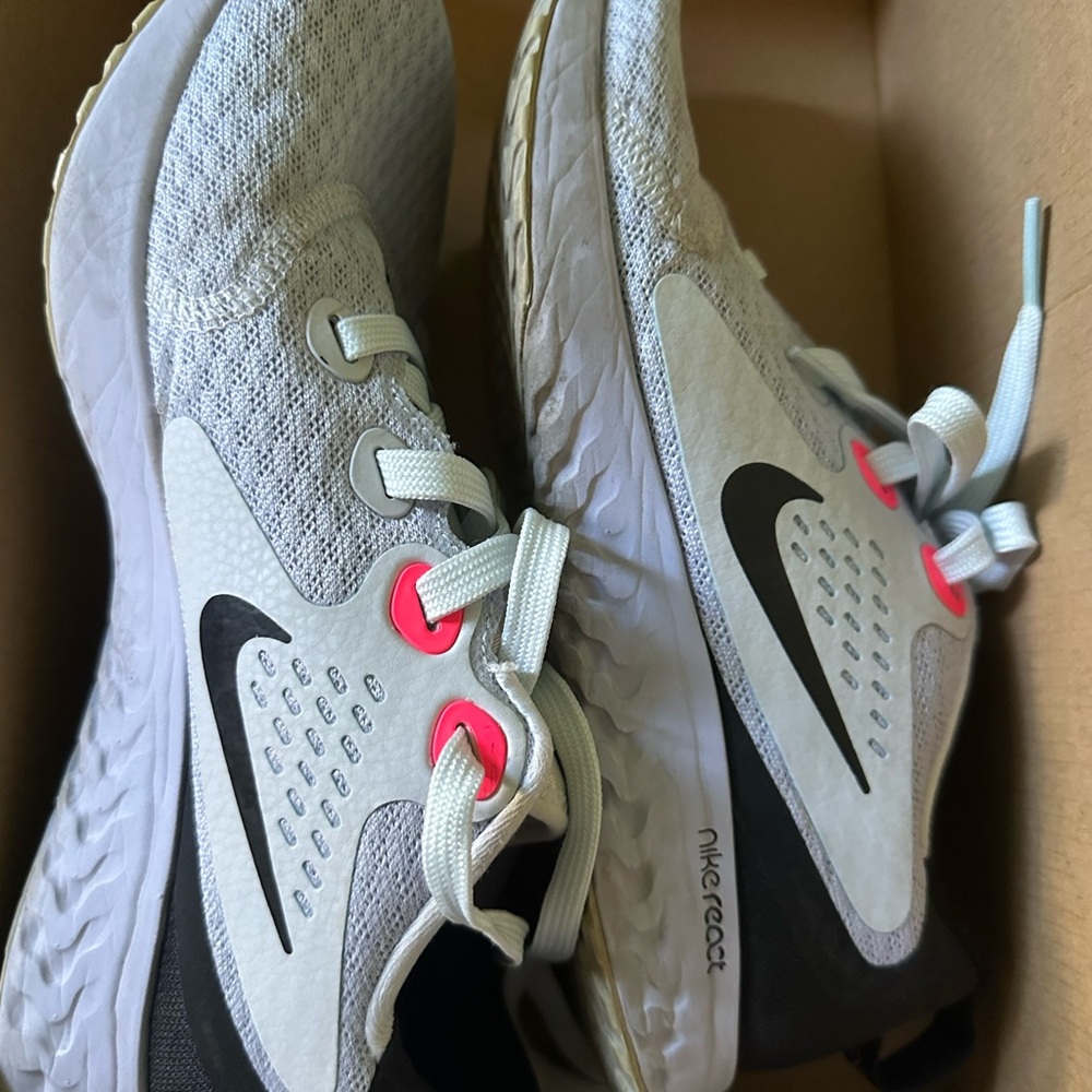 Nike woman’s White/Gray React Running Shoes with Pink Accents